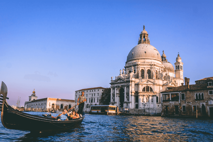 gondola on the canal in venice italy near the saint marco cathedral